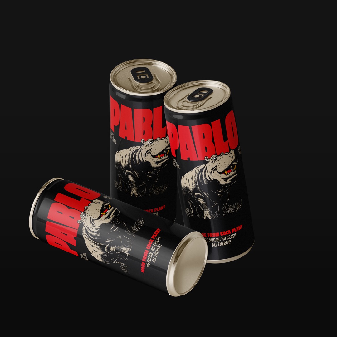 Close view of three black Pablo Beer cans: two upright and one on its side.